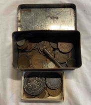 A tin containing a small collection of coins
