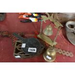 A small collection of metalware including miniature temple bell, stove iron, etc.