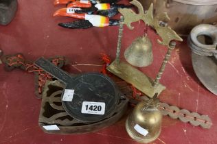 A small collection of metalware including miniature temple bell, stove iron, etc.