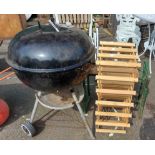 A metal garden BBQ - sold with a wooden wine rack