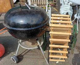 A metal garden BBQ - sold with a wooden wine rack