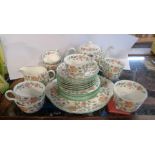 A quantity Mintons bone china teaware, decorated in the Haddon Hall pattern including teapot, (lid