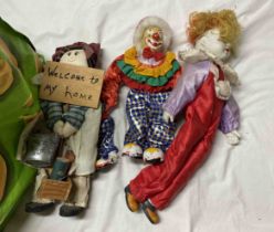 A bag containing a quantity of vintage clown dolls, etc.