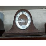 A vintage oak cased Napoleon hat mantel clock with Hermle eight day gong striking movement