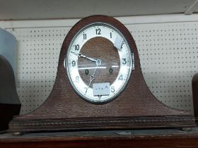 A vintage oak cased Napoleon hat mantel clock with Hermle eight day gong striking movement