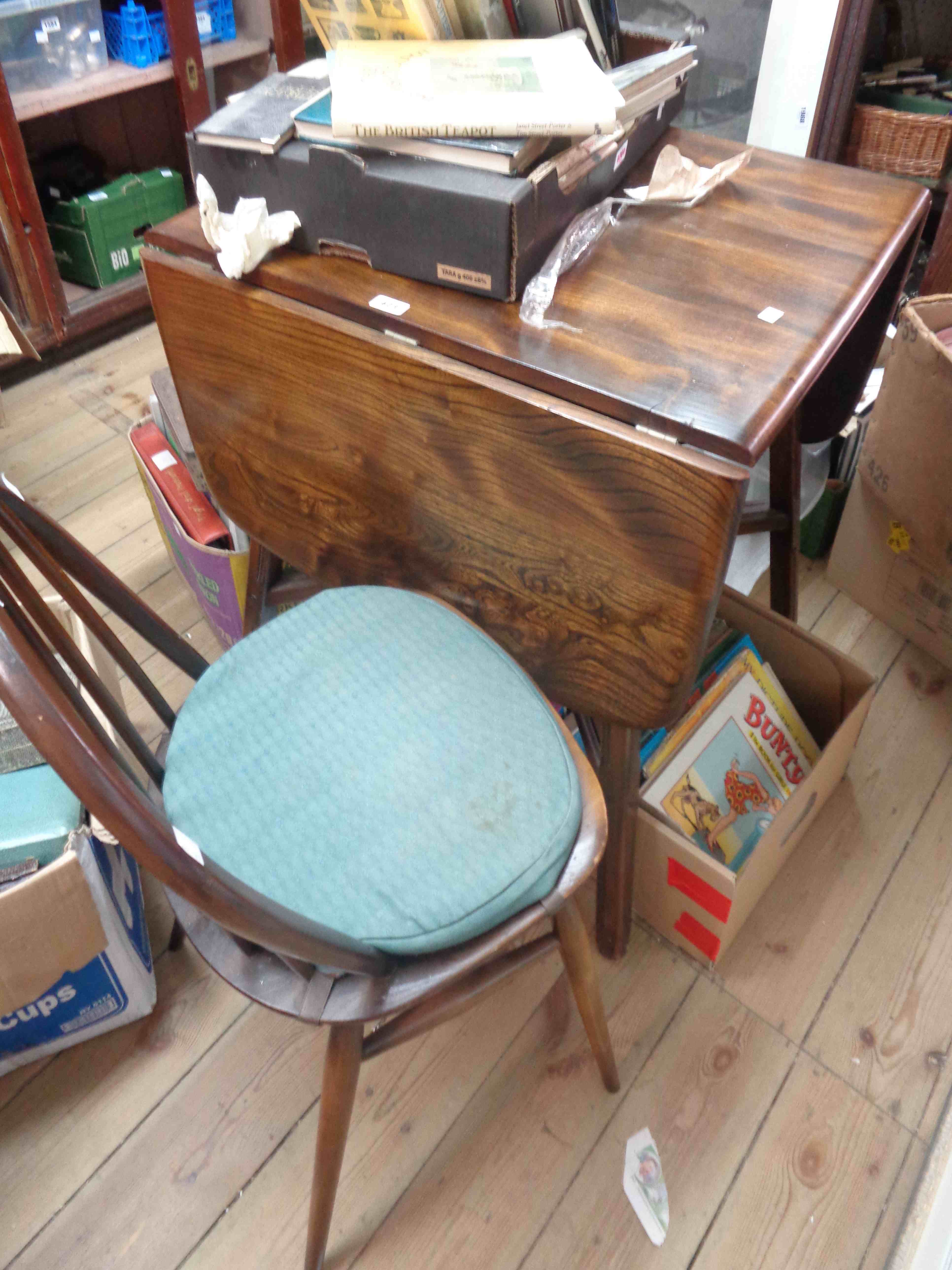 A 74cm vintage Ercol elm drop-leaf dining table, set on moulded supports - sold with a set of four