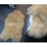 Two vintage sheep skin rugs