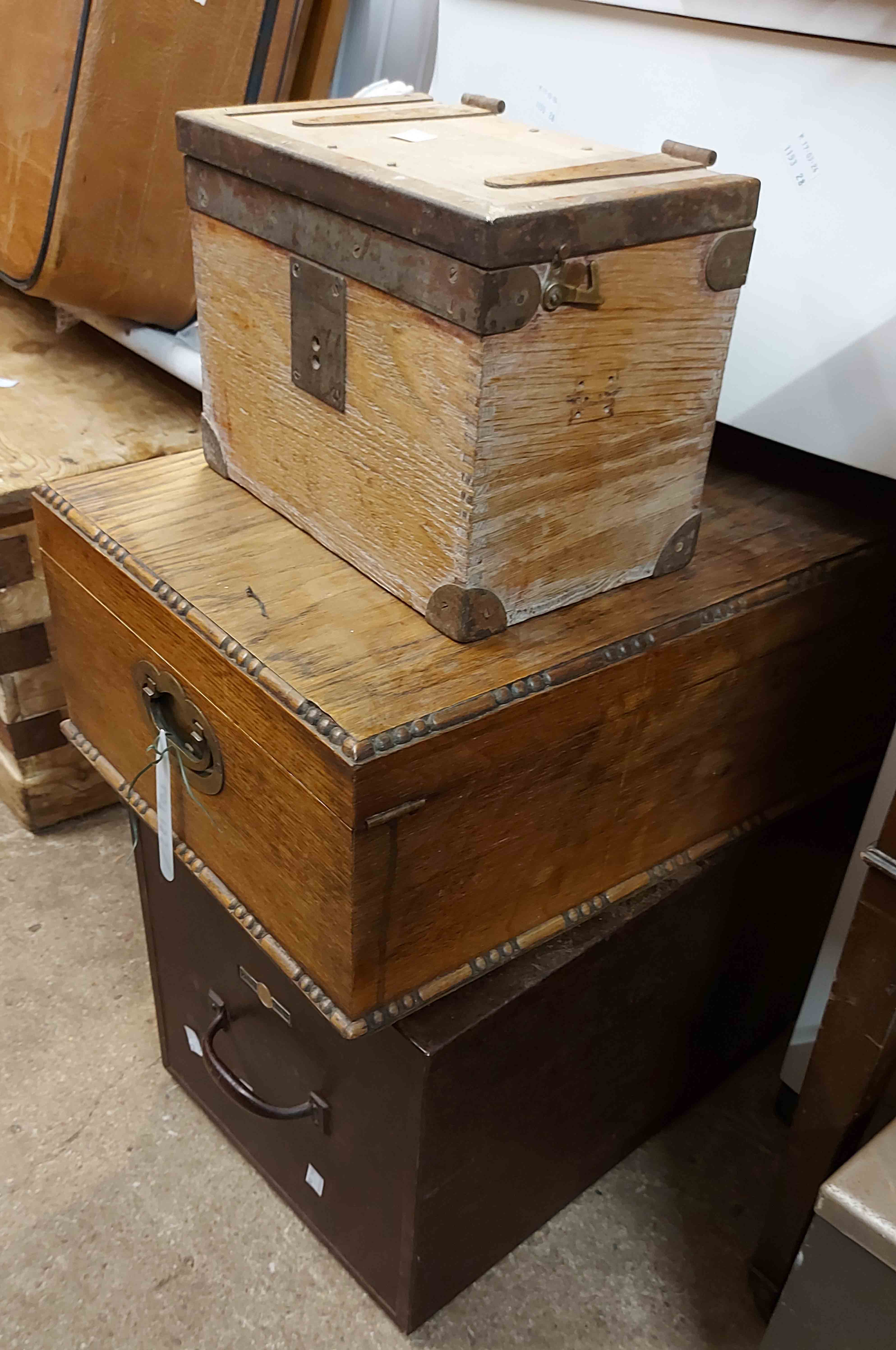 A metal trunk - locked shut - sold with a small wooden box and a cutlery box