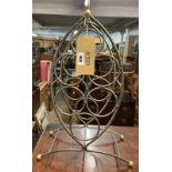 A small vintage metal wine rack