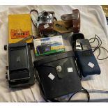 A quantity old cameras and cased binoculars including Swiss Grand Prix binoculars, a Kodak Junior