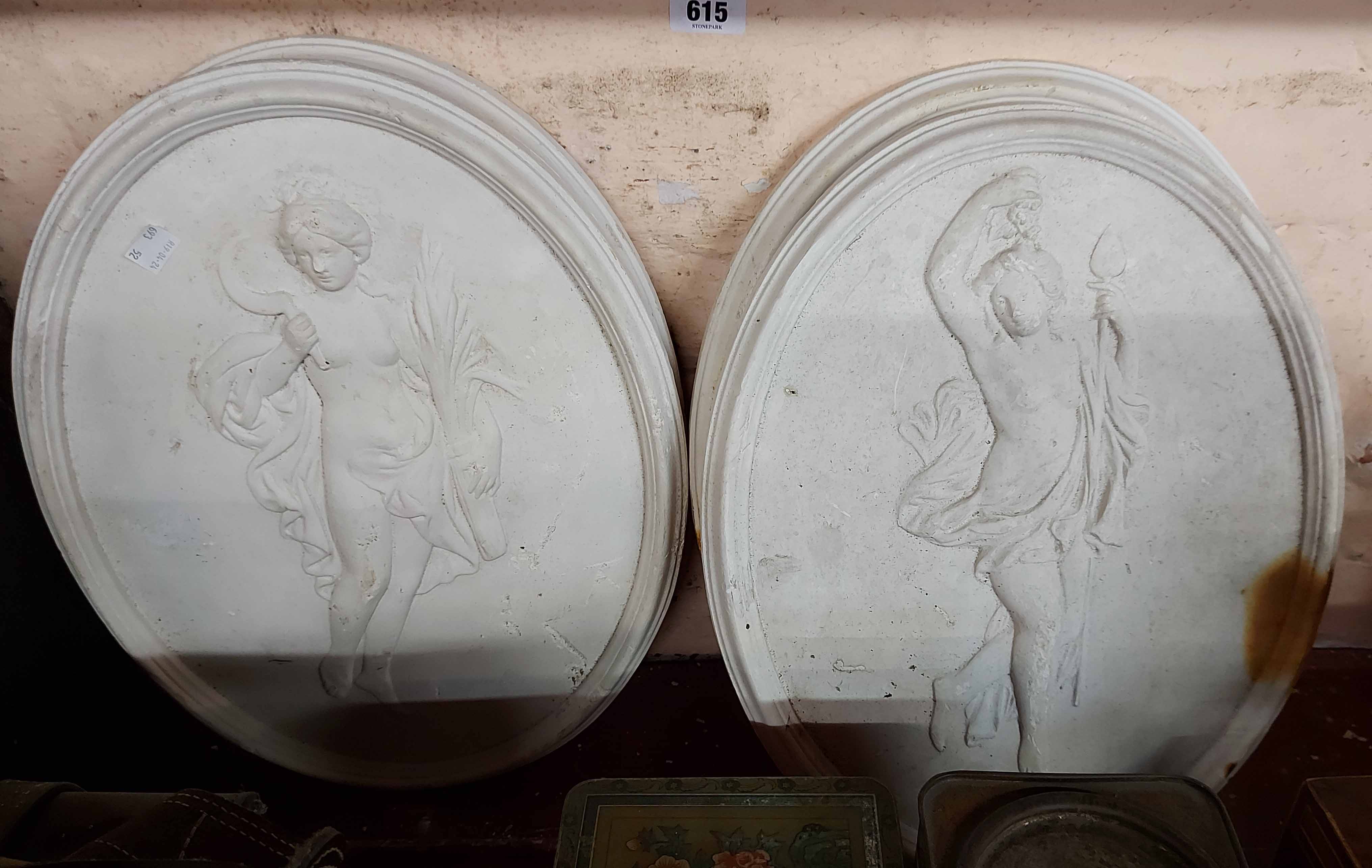 Four oval plaster plaques, depicting classical maidens
