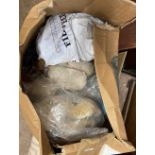 A box containing a large quantity of wool and sewing yarns