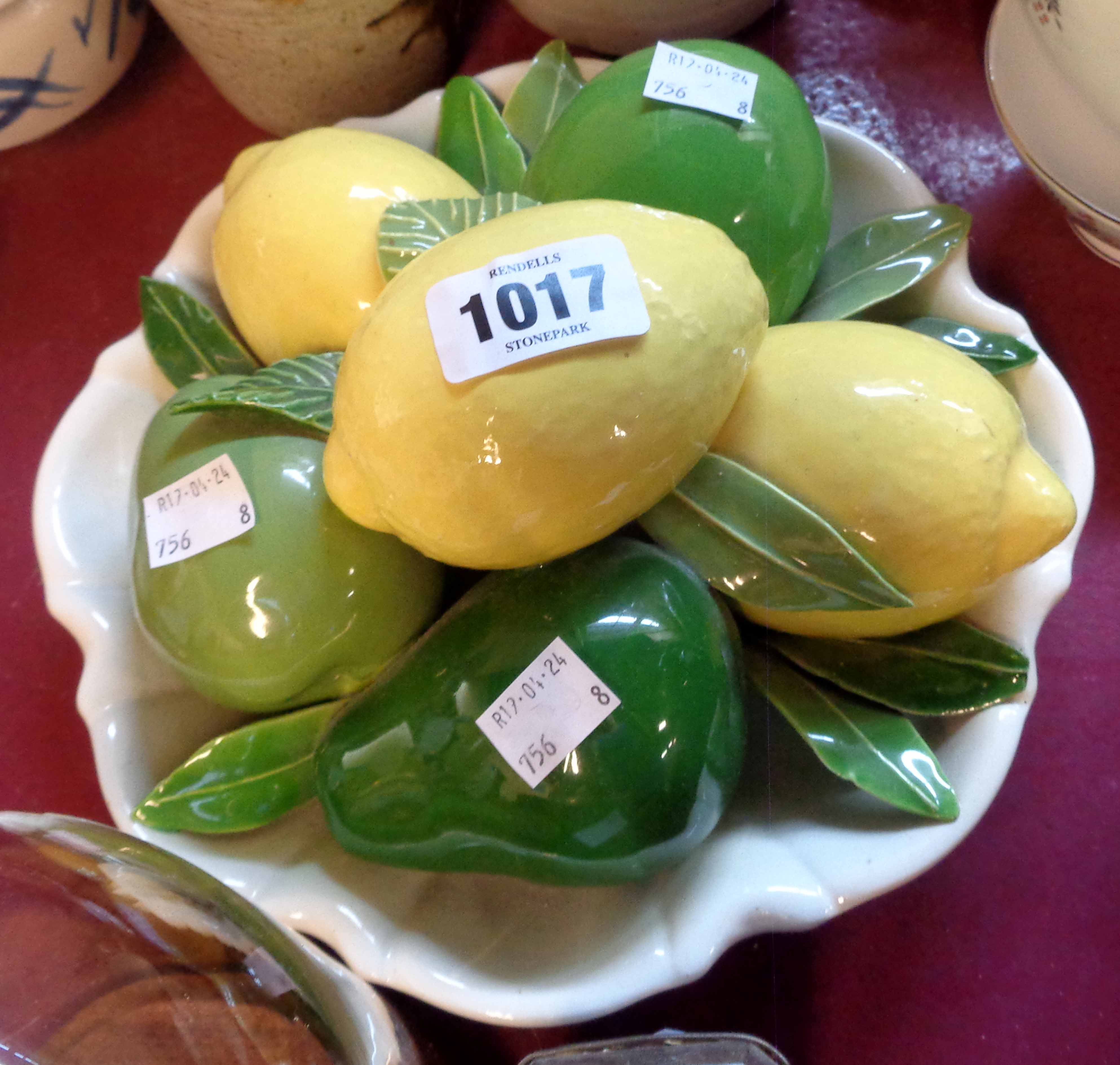 An Italian ceramic table decoration in the form of a bowl of fruit