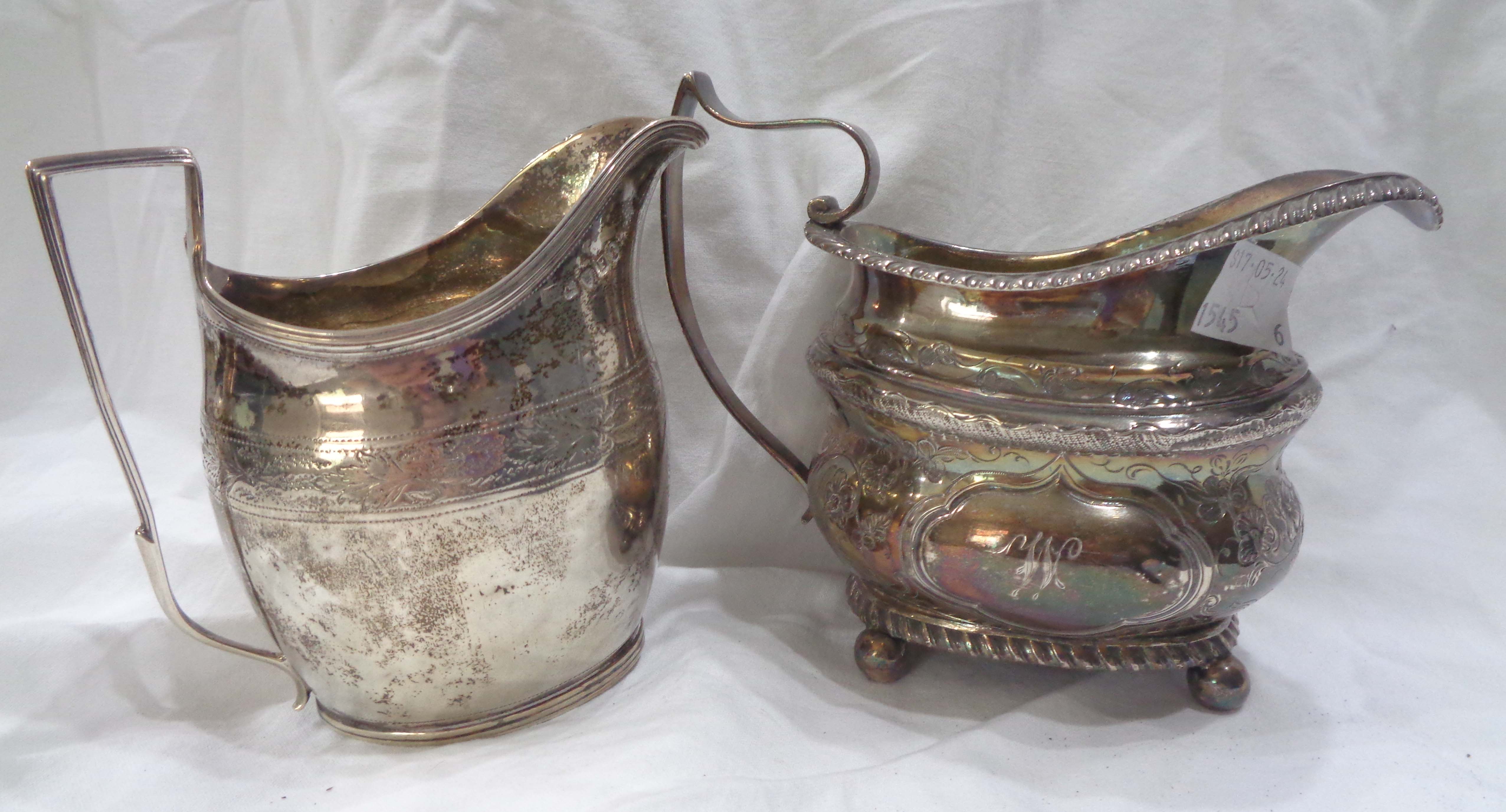 A George III silver cream jug with pricket decoration and initials to front - London 1801 - sold