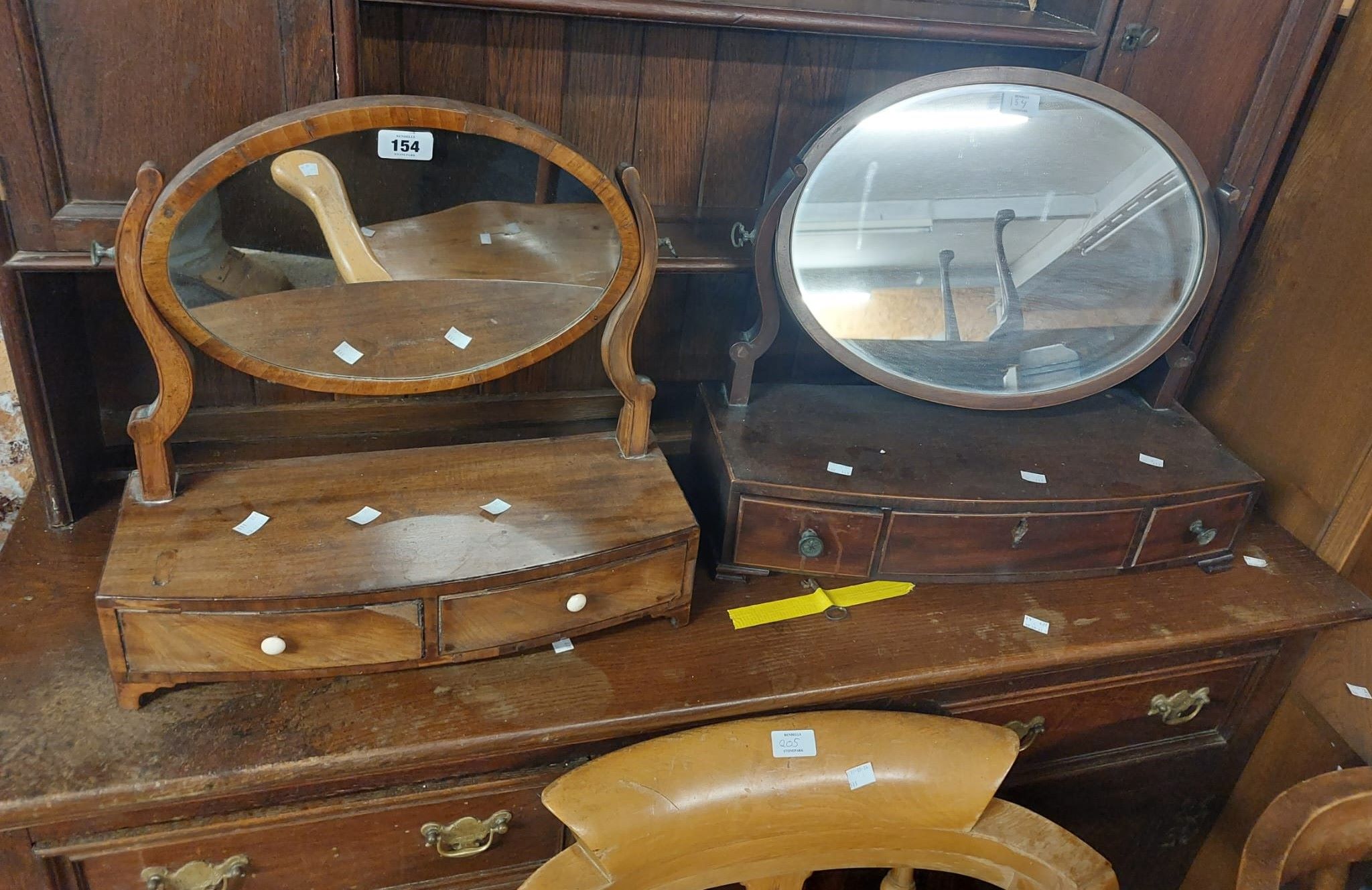 Two similar 19th Century mahogany platform dressing table mirrors, both with drawers to base -