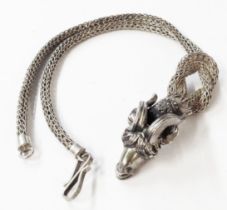 An ornate marked 925 white metal necklace with cast goat's head pattern terminal on a knotted mesh-