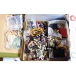 A box containing a large quantity of assorted costume jewellery and collectable items