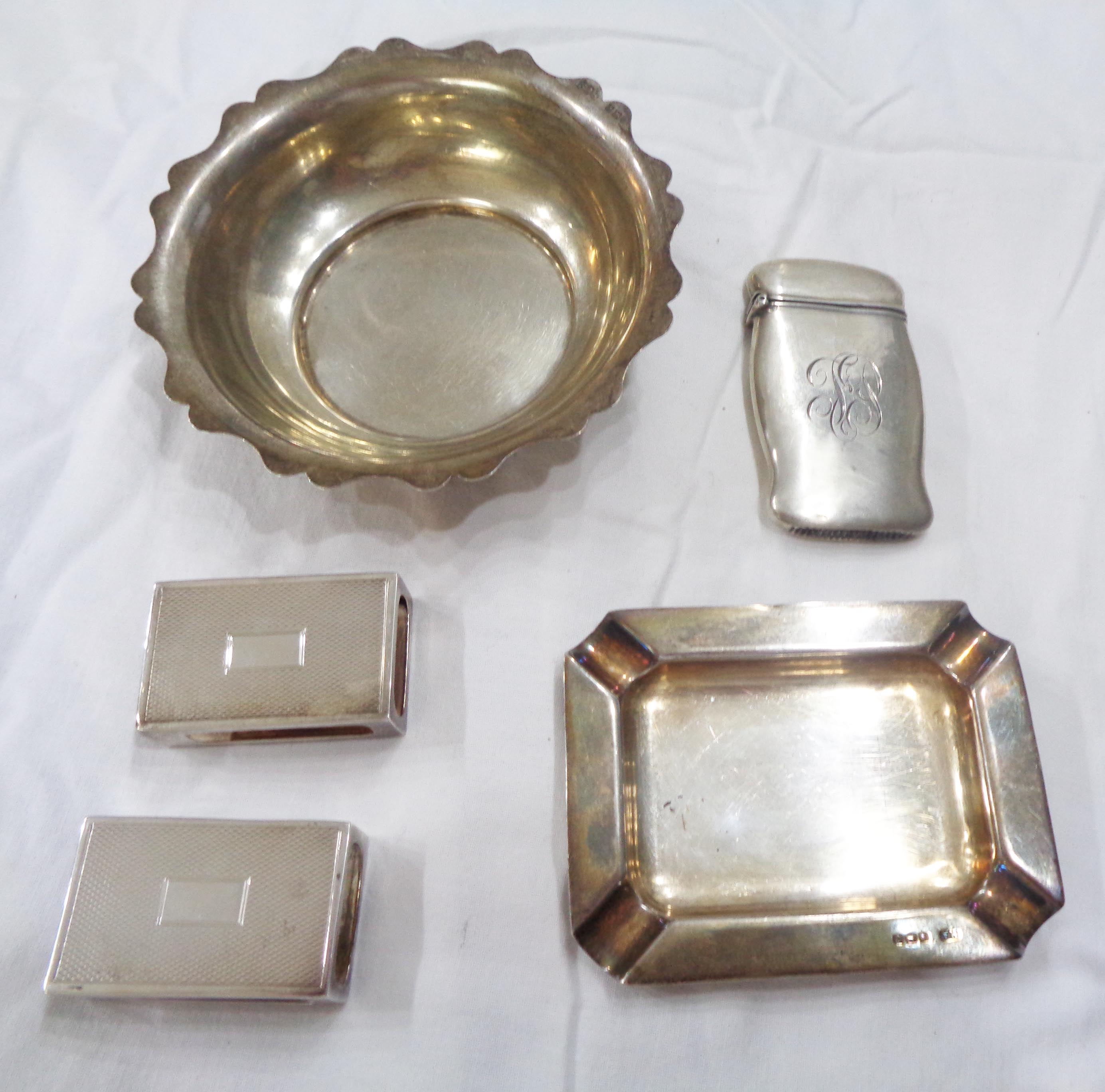 A silver ashtray, small dish and two matchbox sleeves - sold with a 'sterling' vesta case with