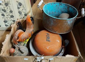 A box containing two vintage fire bells, a pair of painted cast iron cockerels, etc.