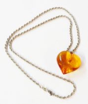 A marked 375 white metal rope twist neck chain with honey amber heart shaped pendant