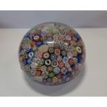 A 19th Century Baccarat silhouette paperweight with carpet ground millefiori and animal silhouette