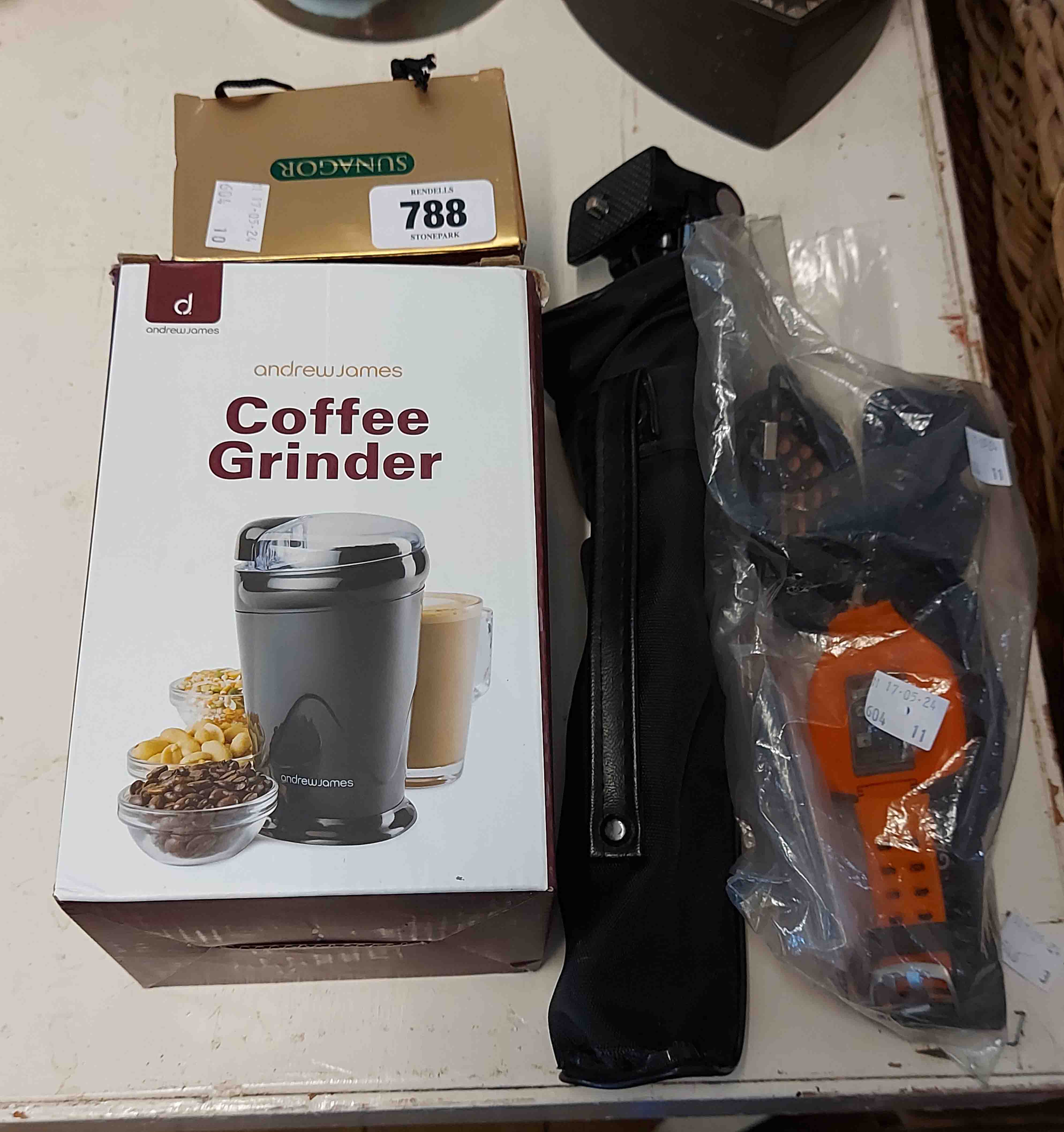 A boxed Sunagor Magnascope - sold with a coffee grinder, camera tripod and Garmin watch