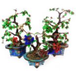 Three Bonsai tree ornaments with wrapped wire branches, enamel and metal leaves and blooms each