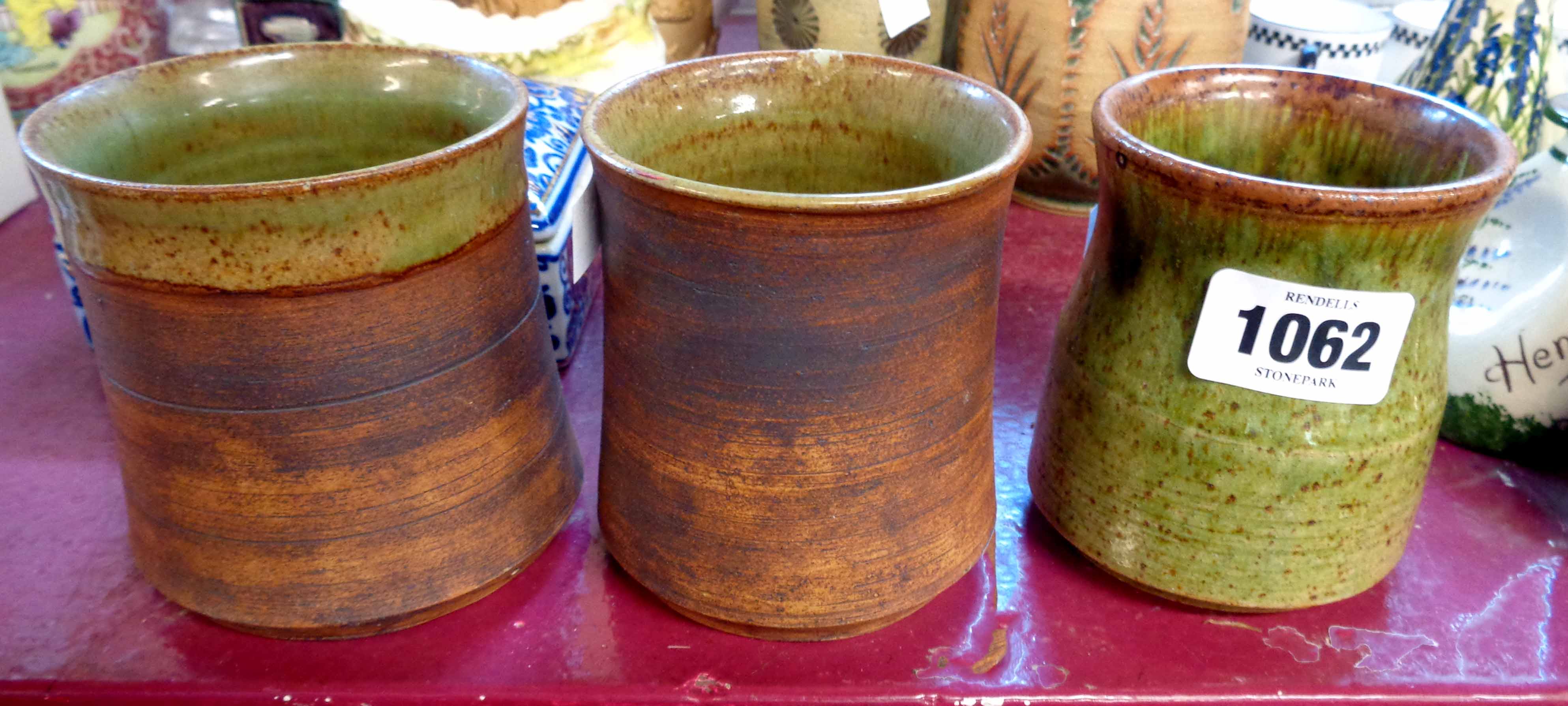 Three Doug Jones Studio Pottery tumblers/vases - one a/f