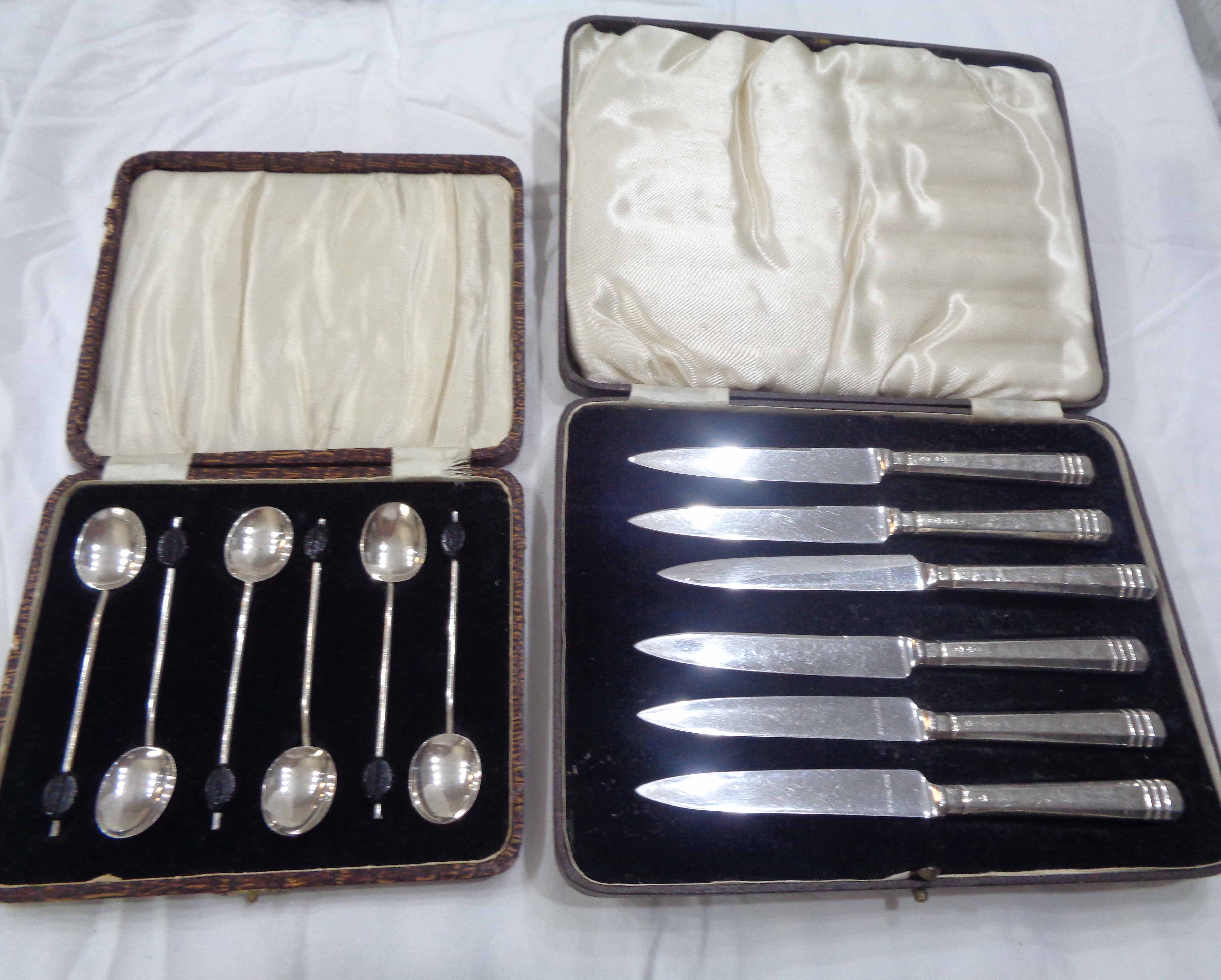 A cased set of six silver coffee bean spoons - sold with a cased set of six silver handled tea