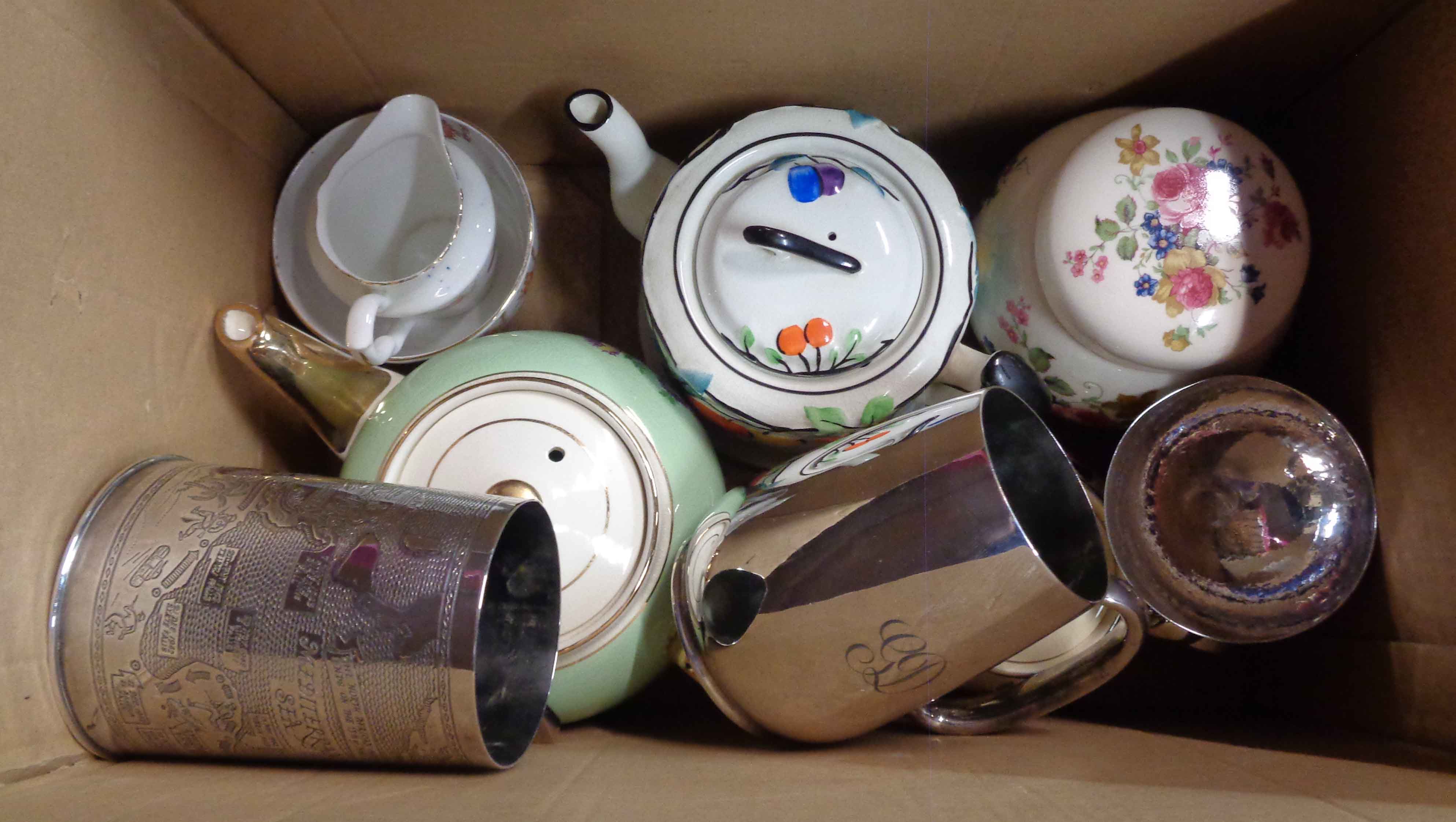 A box containing a quantity of ceramics and collectable items including teapots, tankards, etc.