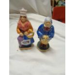 A pair of vintage French Normandie pottery figures, depicting a peasant man and woman off to market