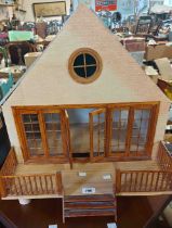 A vintage doll's house - sold with a box of accessories