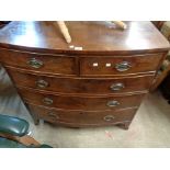 A 1.06m 19th Century mahogany bow front chest of two short and three long graduated drawers, set