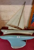 A wooden pond yacht - sold with two other wooden boats