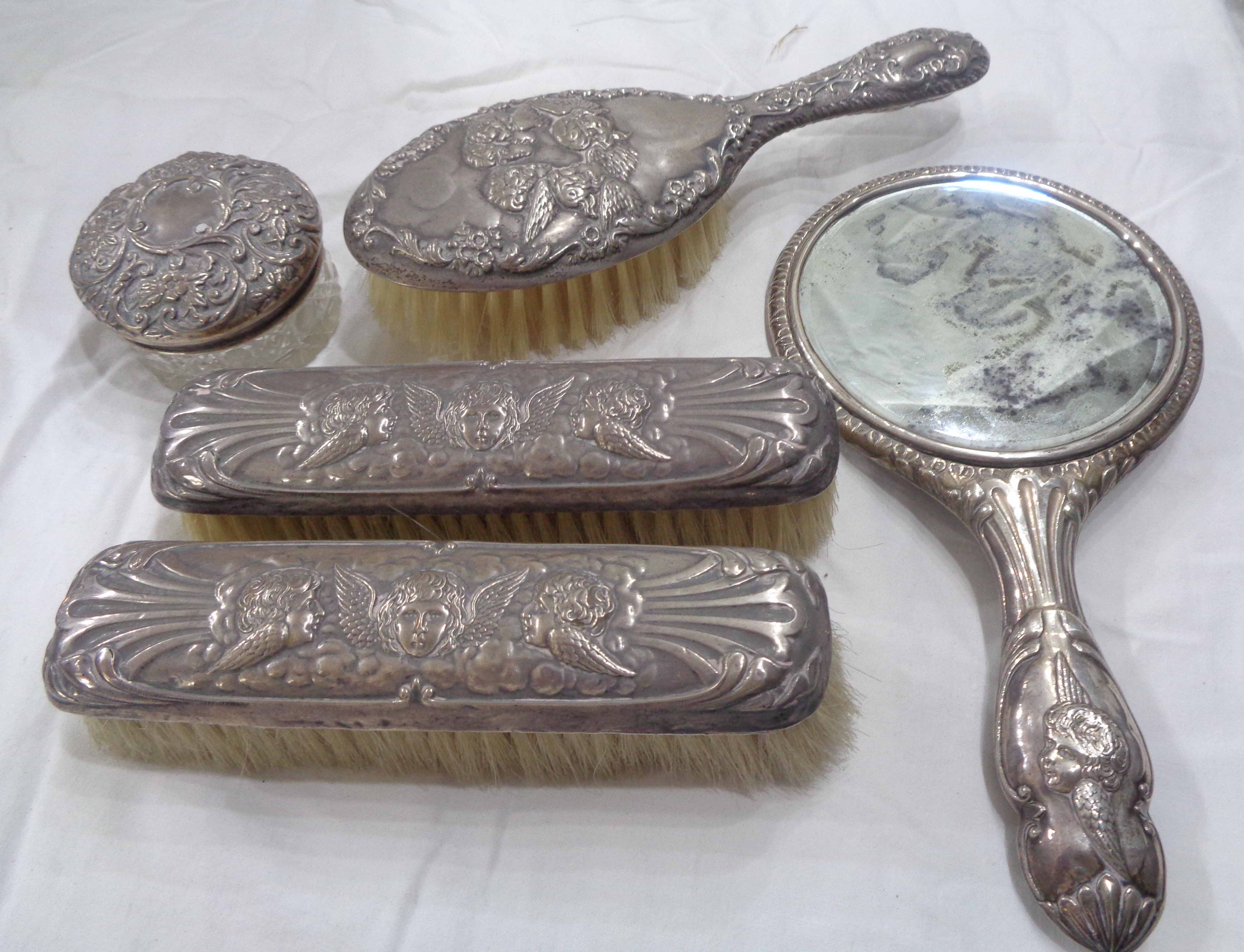 A harlequin five piece silver mounted dressing table hand mirror, brush and glass pot set, mainly