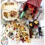 A bag containing a quantity of assorted costume jewellery and other collectable items
