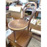 A late 19th Century child's bentwood standard chair with machine pressed seat panel and bearing