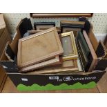 A box containing a large selection of vintage and other small picture frames, some with images