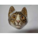 A Winstanley pottery wall mask, depicting a tabby cat's face with inset glass eyes