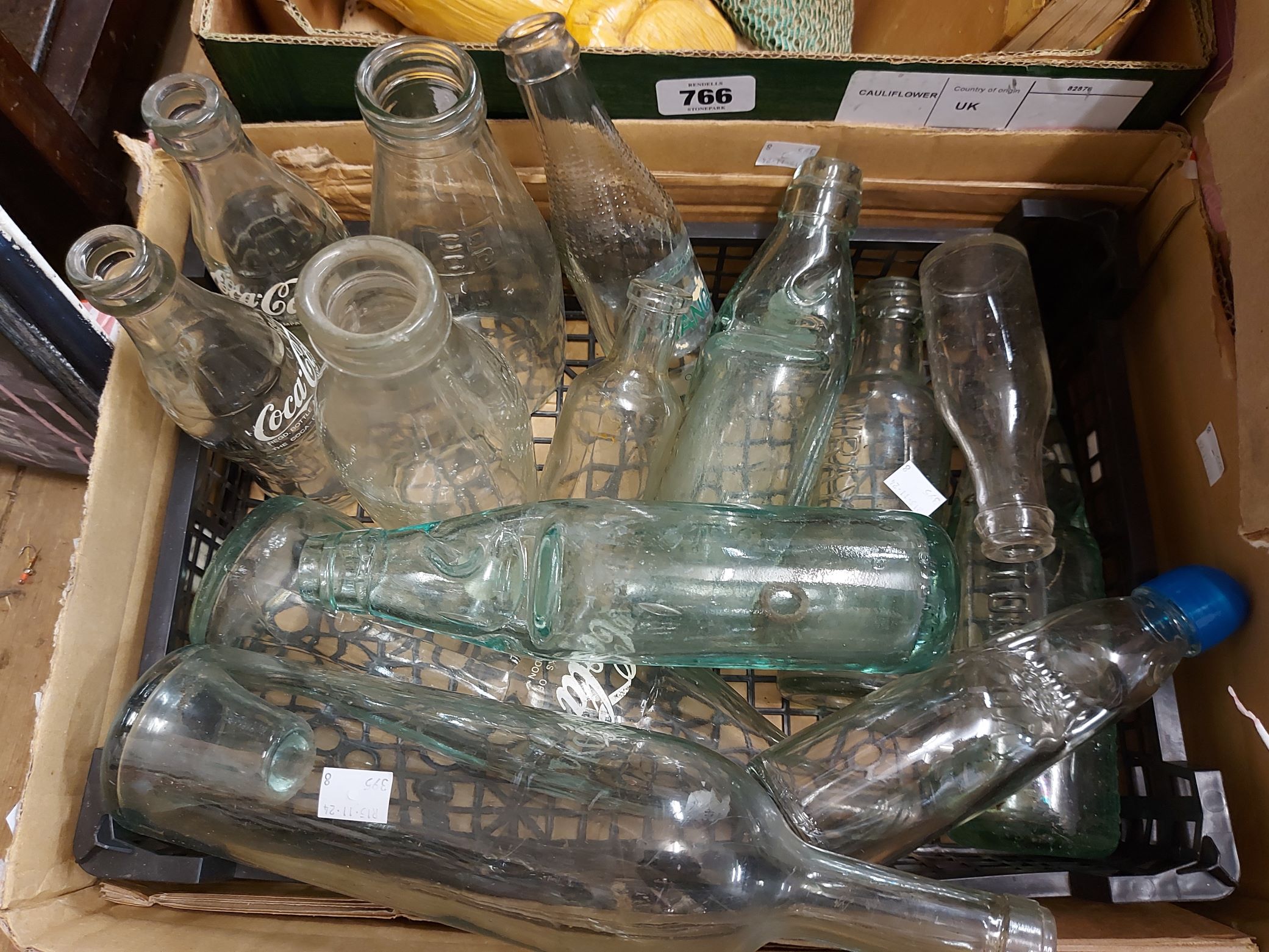 A box containing a quantity of codd bottles and other bottles