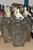 A COLLECTION OF GLASS SODA SYPHONS, five vintage Schweppes glass bottle soda syphons, some of the