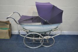 A VINTAGE WHITE WILSON PRAM, with purple cover and hood, along with a boxed green hood (condition
