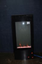 A FOCALPOINT EF11-16 MODERN GLASS FIRE EFFECT HEATER with 'crystal coals', colour change lighting,