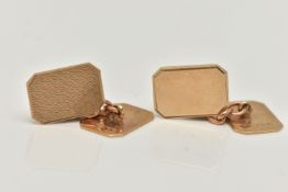 A PAIR OF 9CT GOLD CUFFLINKS, rectangular panels with cut off corners, one panel with an engine