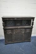 A 20TH CENTURY OAK COURT CUPBOARD, the top section with two lead glazed panels, flanking a central