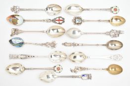AN ASSORTMENT OF SILVER AND WHITE METAL SPOONS, to include four silver souvenir spoons, all with