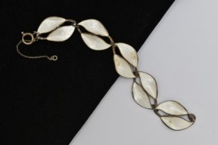 A NORWEIGAN ENAMEL BRACELET, a white metal leaf design bracelet, white guilloche enamel detail to