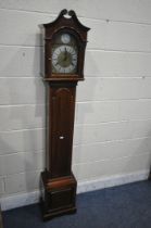 A 20TH CENTURY MAHOGANY TEMPUS FUGIT LONG CASE CLOCK, the arched dial enclosing a seven inch brass