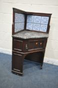 AN EARLY 20TH CENTURY MAHOGANY MARBLE TOP CORNER WASHSTAND, with tiled raised back and a single