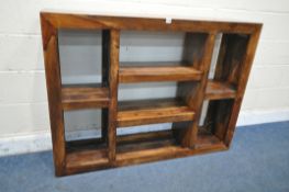 A HARDWOOD BOOKCASE, fitted with an arrangement of four fixed shelves, width 134cm x depth 30cm x